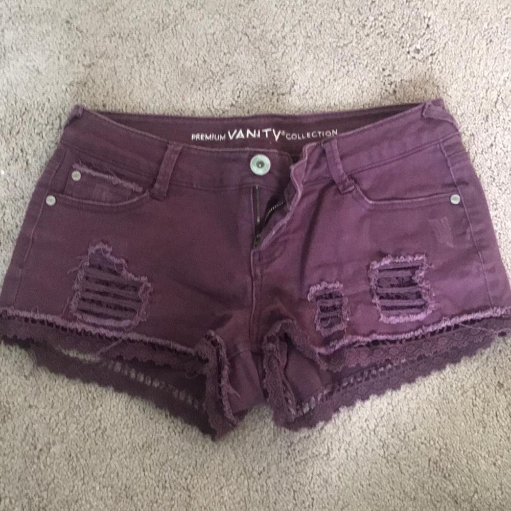 Distressed purple jean shorts